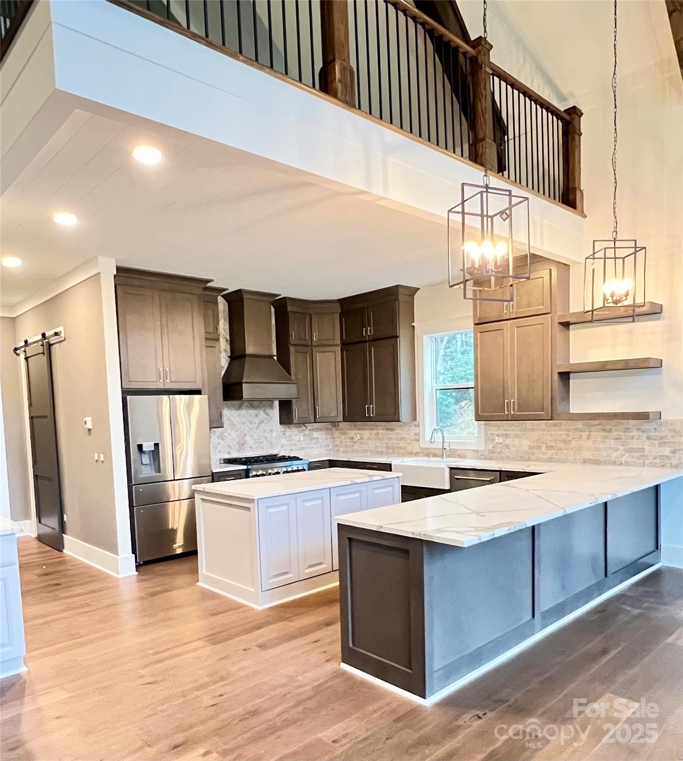 159 Comanche Road Cullowhee, NC 28723 - Photo 8 of 34 a kitchen with stainless steel appliances granite countertop a sink and a refrigerator