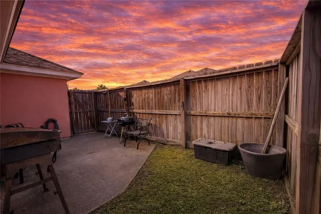 a view of chair and table in patio