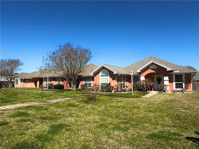 a view of a lake with houses in the back