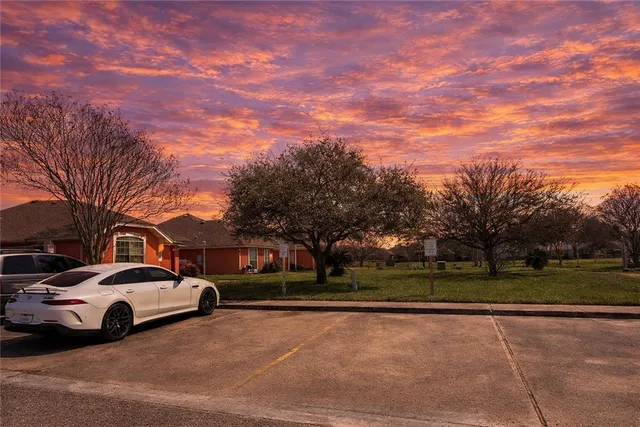 a view of street with parked cars
