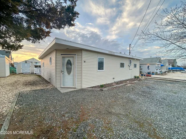 a view of room with window and wooden floor