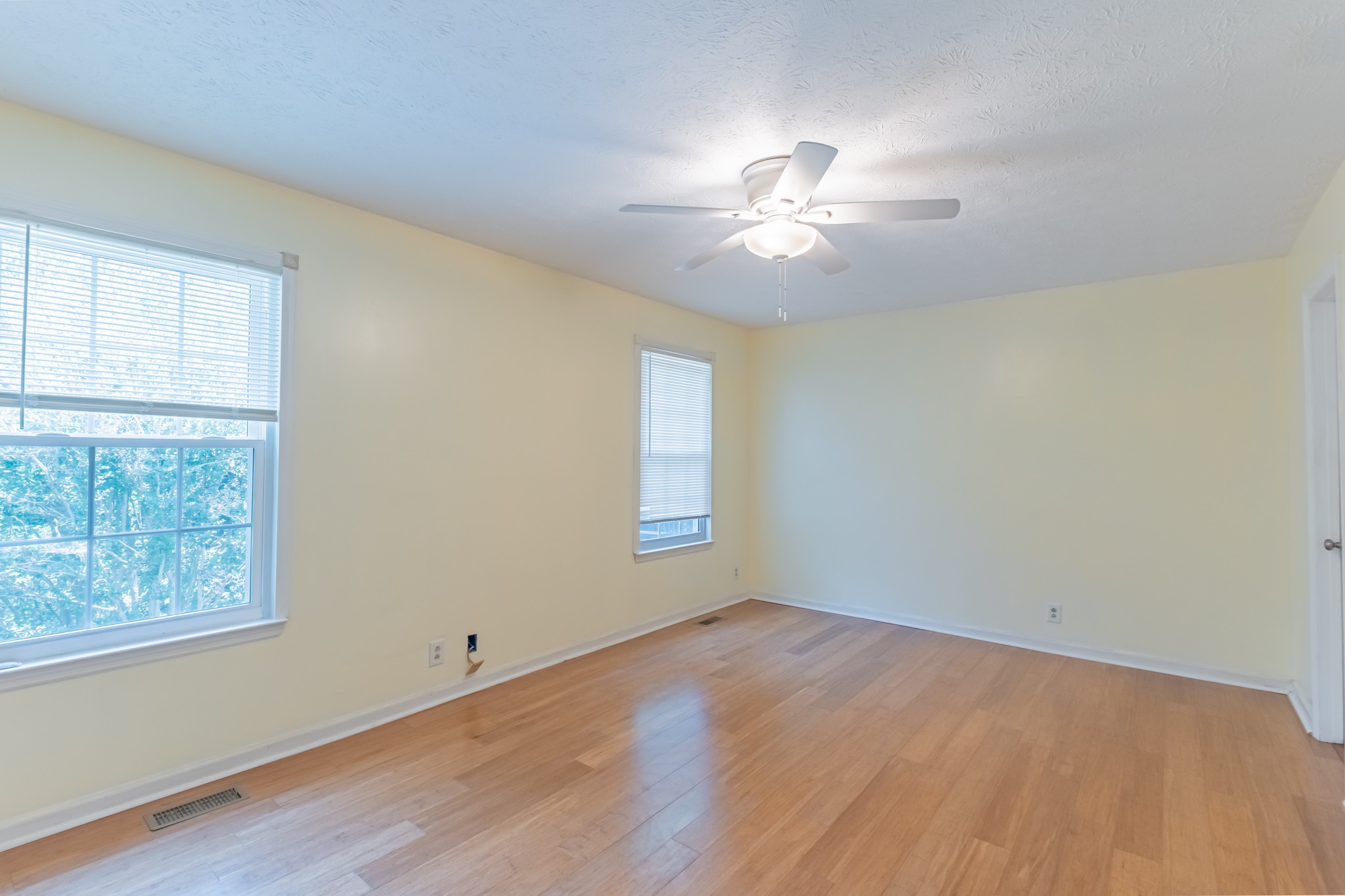 181 Bonnafield Drive Hermitage, TN 37076 - Photo 13 of 44 a view of empty room with wooden floor and fan