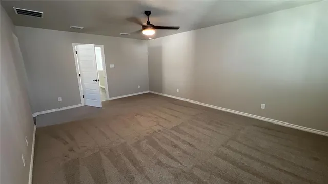 an empty room with a bathroom
