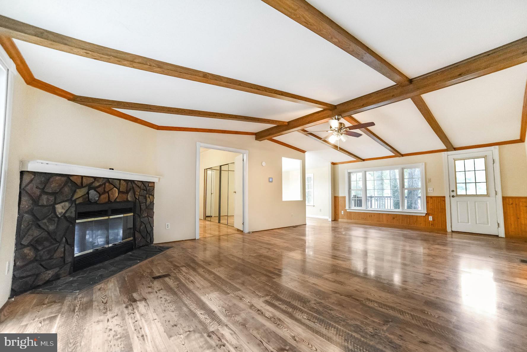 23293 By The Mill Road California, MD 20619 - Photo 4 of 28 Spacious family room with easy-care laminate floor