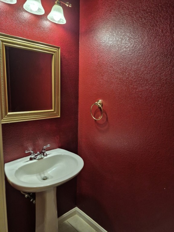 808 Busleigh Castle Way Pflugerville, TX 78660 - Photo 15 of 30 a bathroom with a sink and mirror