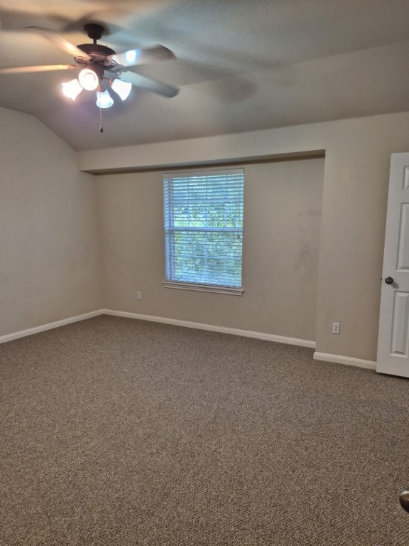 808 Busleigh Castle Way Pflugerville, TX 78660 - Photo 19 of 30 an empty room with a chandelier fan and windows