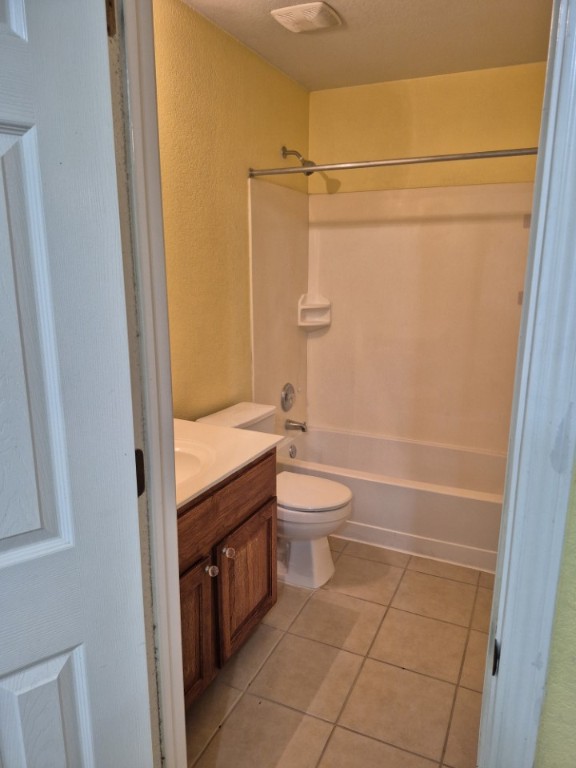 808 Busleigh Castle Way Pflugerville, TX 78660 - Photo 23 of 30 a bathroom with a granite countertop toilet a sink and shower