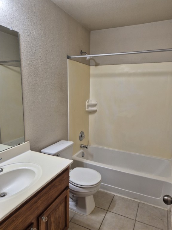 808 Busleigh Castle Way Pflugerville, TX 78660 - Photo 27 of 30 a bathroom with a granite countertop sink toilet a mirror and shower