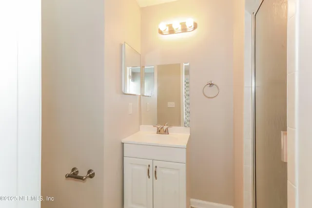 a bathroom with a sink and mirror
