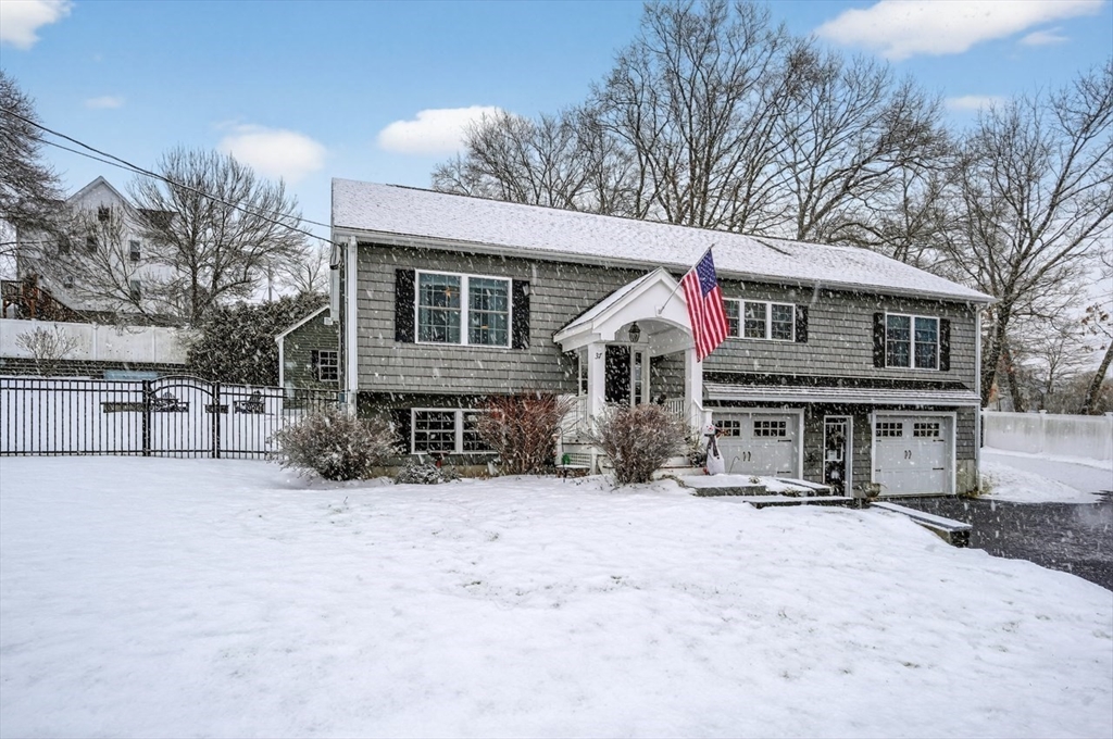 37 Tower Street Hudson, MA 01749 - Photo 2 of 35 a view of house with a yard covered in snow