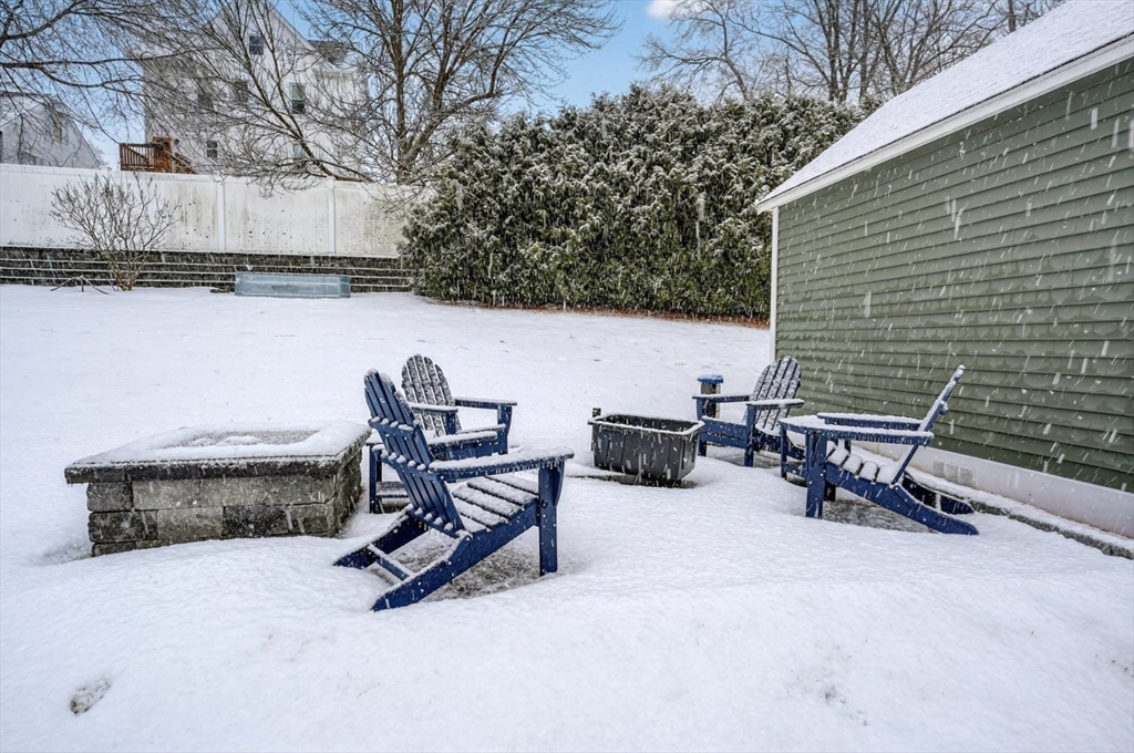 37 Tower Street Hudson, MA 01749 - Photo 27 of 35 a view of a lounge chair and table in the back yard of the house