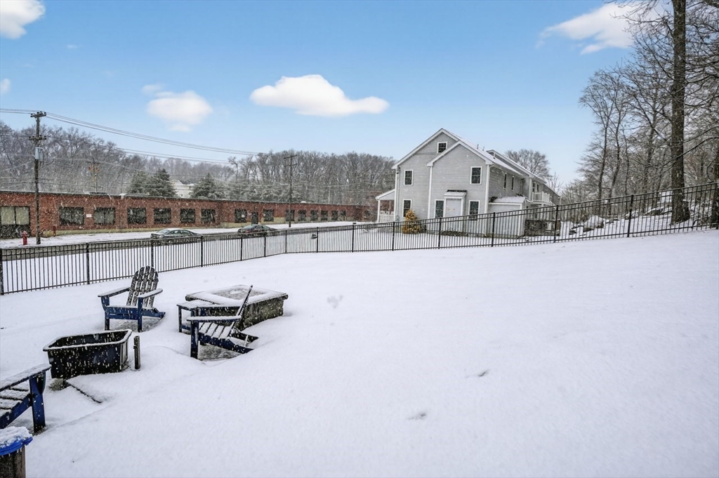 37 Tower Street Hudson, MA 01749 - Photo 28 of 35 a view of a terrace with chairs and wooden fence