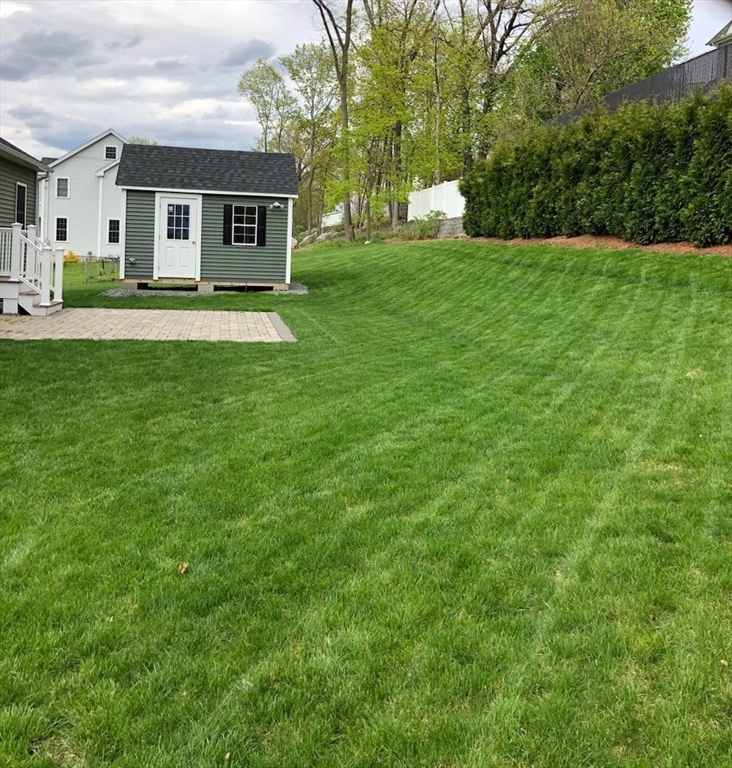 37 Tower Street Hudson, MA 01749 - Photo 35 of 35 a front view of house with yard and trees