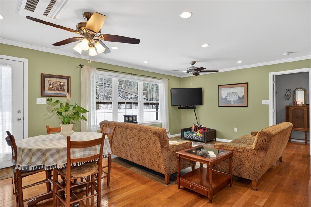 37 Tower Street Hudson, MA 01749 - Photo 9 of 35 a living room with furniture a chandelier and a flat screen tv