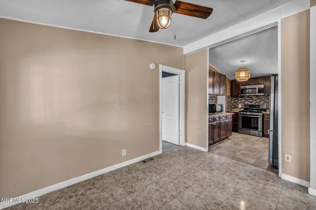 a view of a hallway with a kitchen