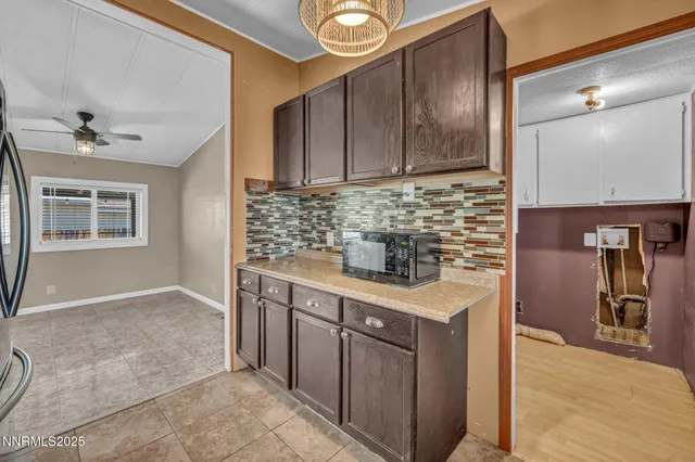 a kitchen with a sink and a stove top oven