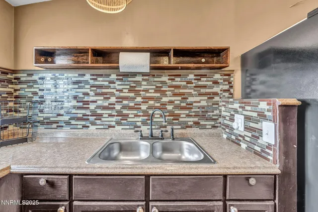 a stove top oven sitting inside of a kitchen