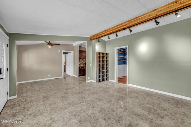 a view of an empty room with a window