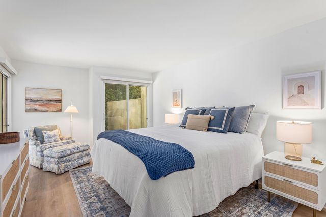 a bedroom with bed and window