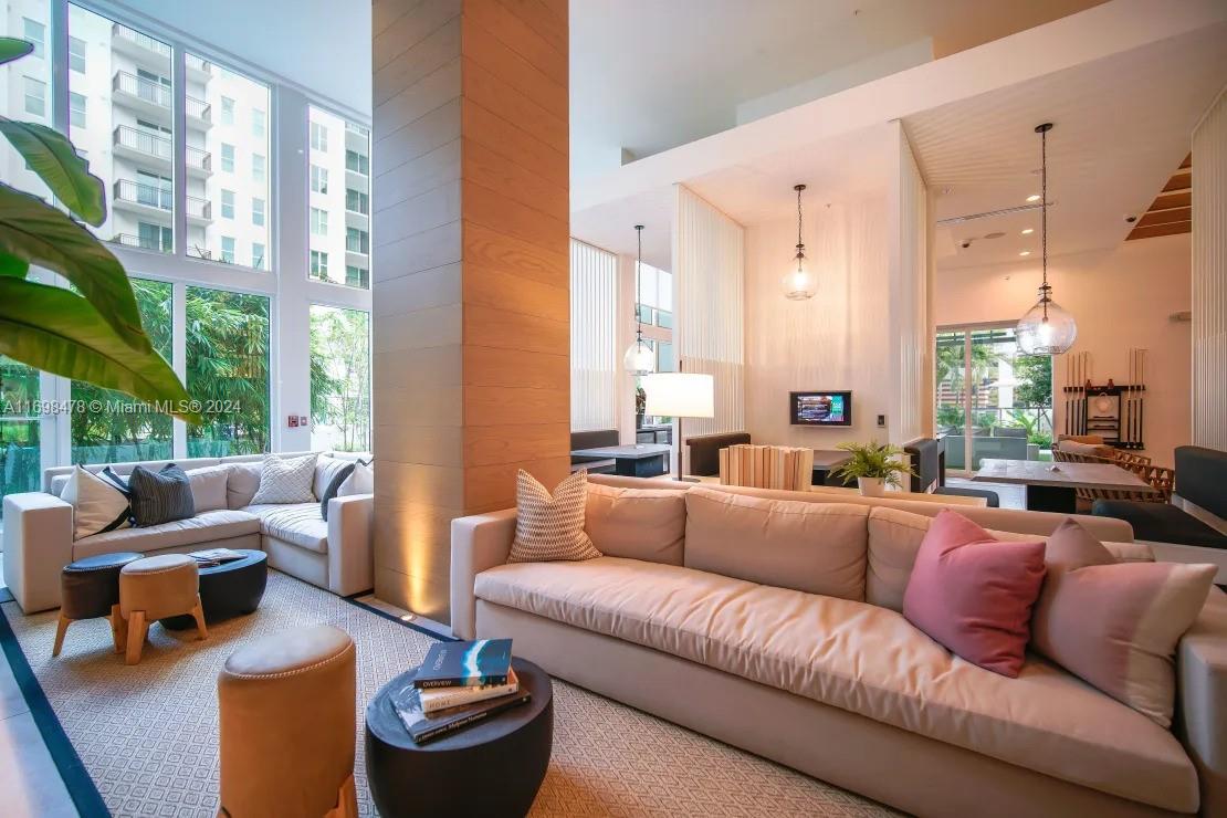 1919 Southeast 10th Avenue, Unit 5104 Fort Lauderdale, FL 33316 - Photo 2 of 35 a living room with furniture and a large window