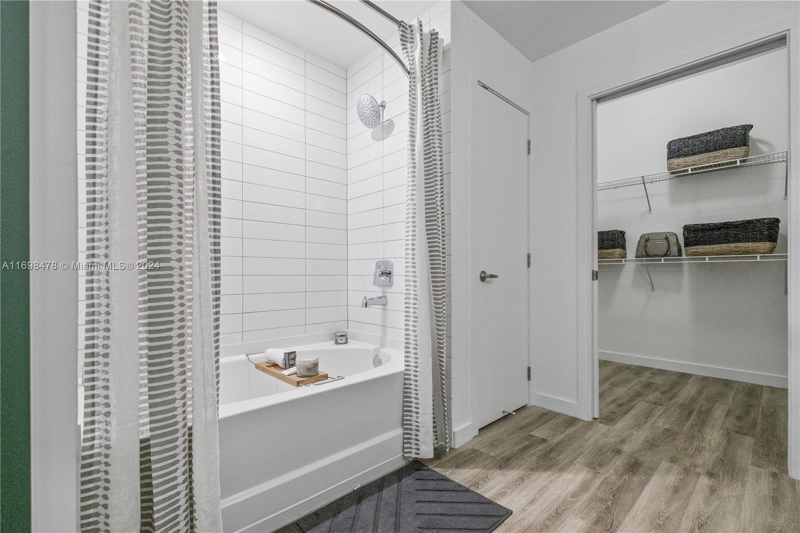 1919 Southeast 10th Avenue, Unit 5104 Fort Lauderdale, FL 33316 - Photo 21 of 35 a bathroom with a bathtub and a sink