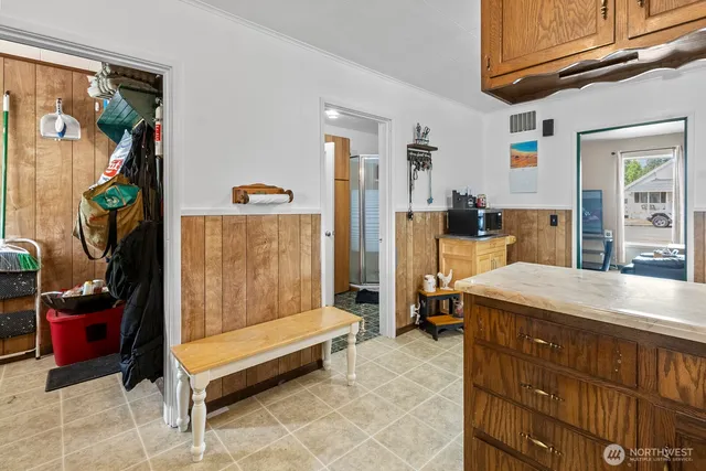 a kitchen with a sink cabinets and appliances