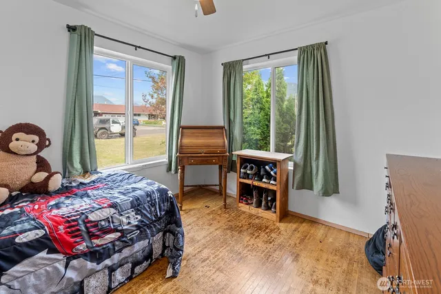 a view of a bedroom with a bed and toys