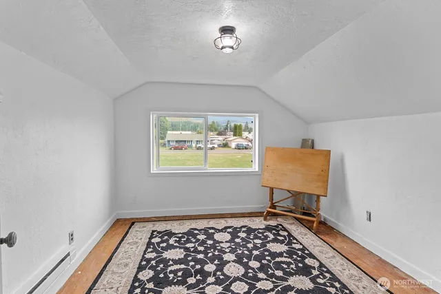 a view of a room that has a bench in it