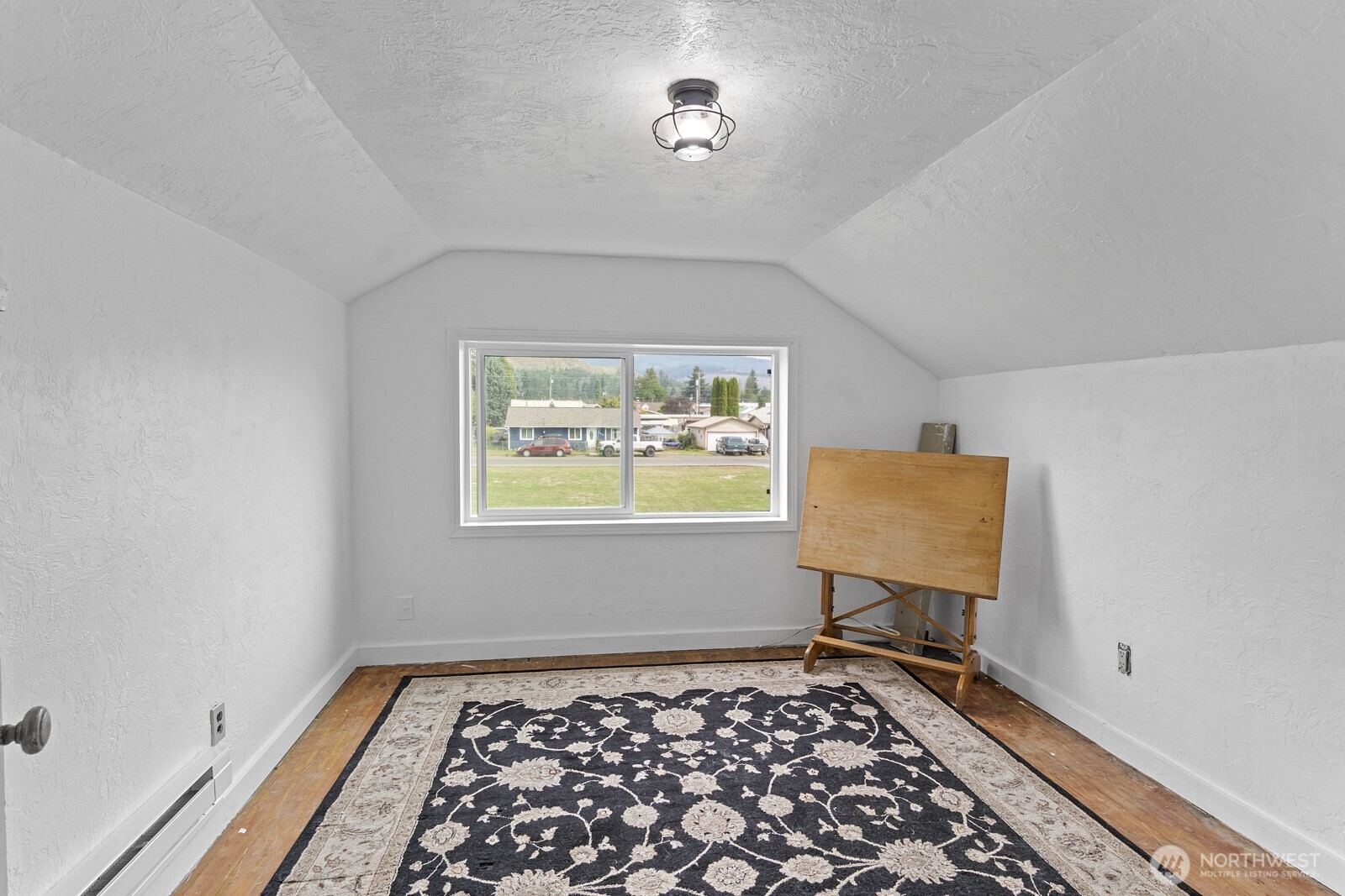 325 3rd Street Morton, WA 98356 - Photo 20 of 40 a room with furniture and a rug