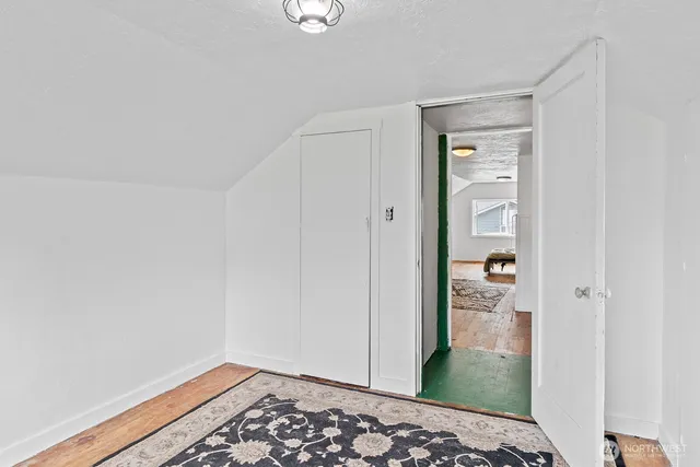 a bedroom with a bed and a table in it