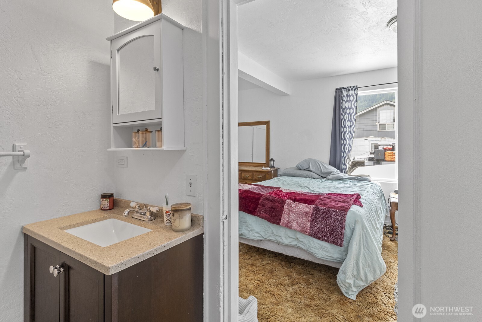 325 3rd Street Morton, WA 98356 - Photo 24 of 40 a en suite bathroom with a sink and a mirror