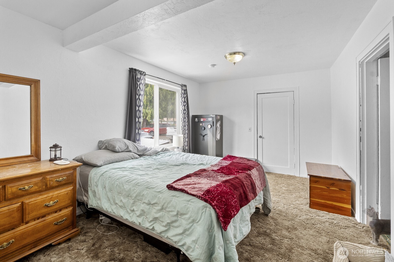 325 3rd Street Morton, WA 98356 - Photo 26 of 40 a bedroom with a bed and a dresser