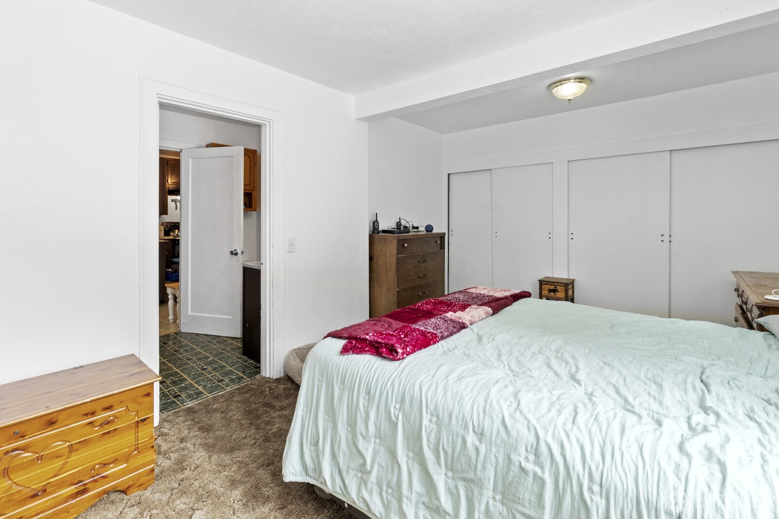 325 3rd Street Morton, WA 98356 - Photo 27 of 40 a bedroom with a bed and a dresser