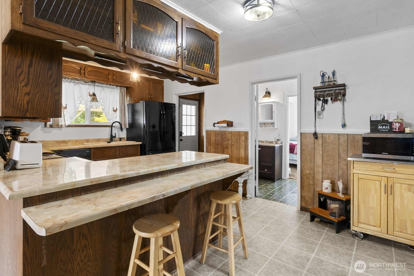 325 3rd Street Morton, WA 98356 - Photo 28 of 40 a kitchen with stainless steel appliances granite countertop a sink a stove and refrigerator