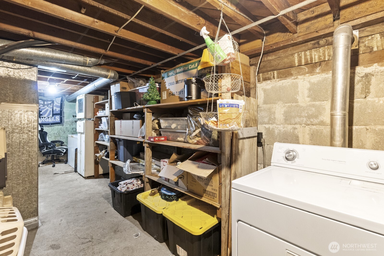 325 3rd Street Morton, WA 98356 - Photo 30 of 40 a view of walk in closet with clothes and shoes