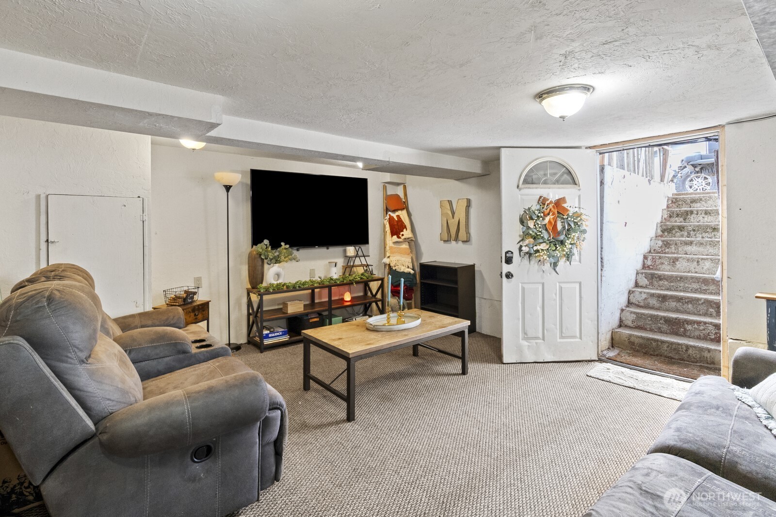 325 3rd Street Morton, WA 98356 - Photo 32 of 40 a living room with furniture and a flat screen tv