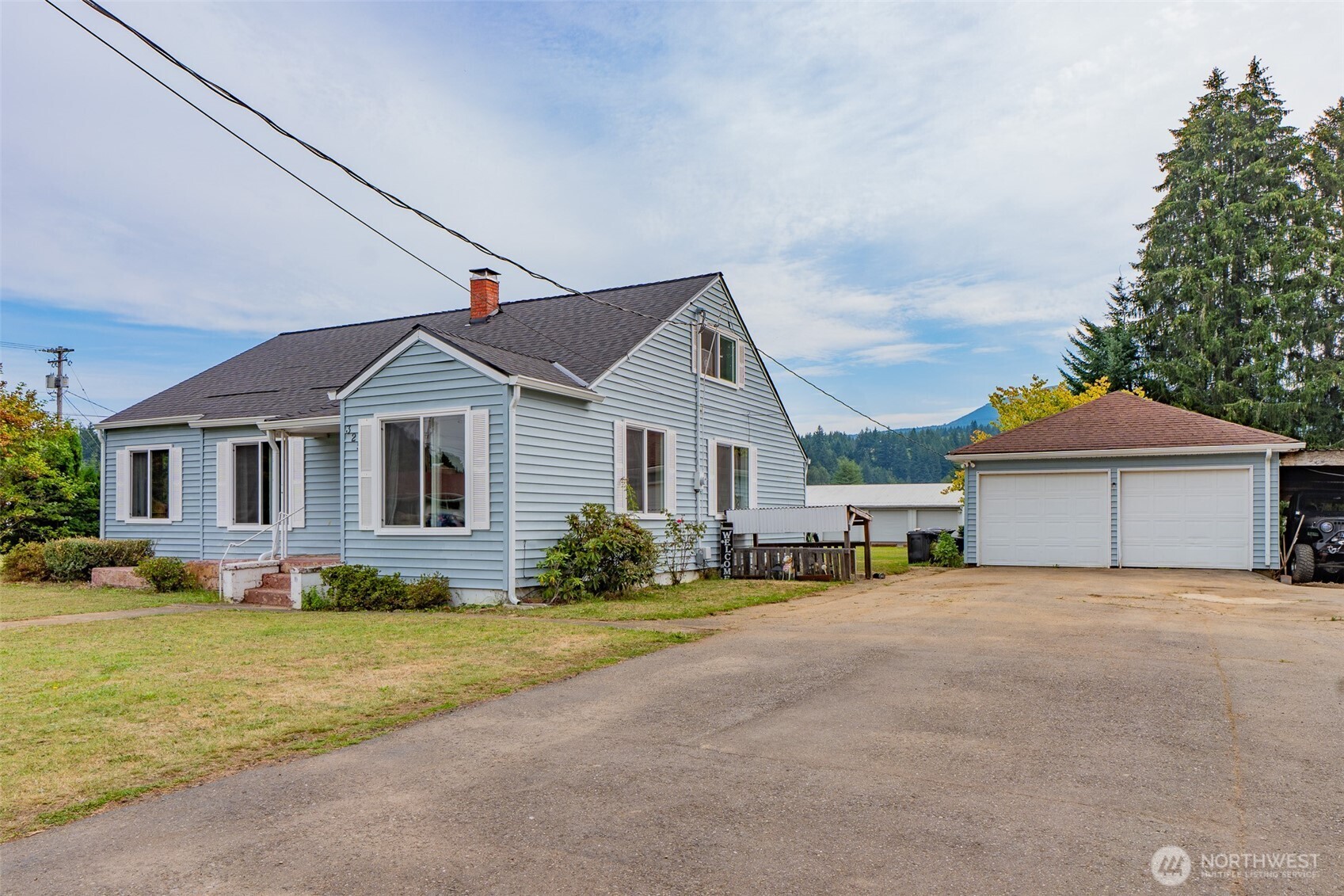 325 3rd Street Morton, WA 98356 - Photo 39 of 40 a front view of a house with a yard
