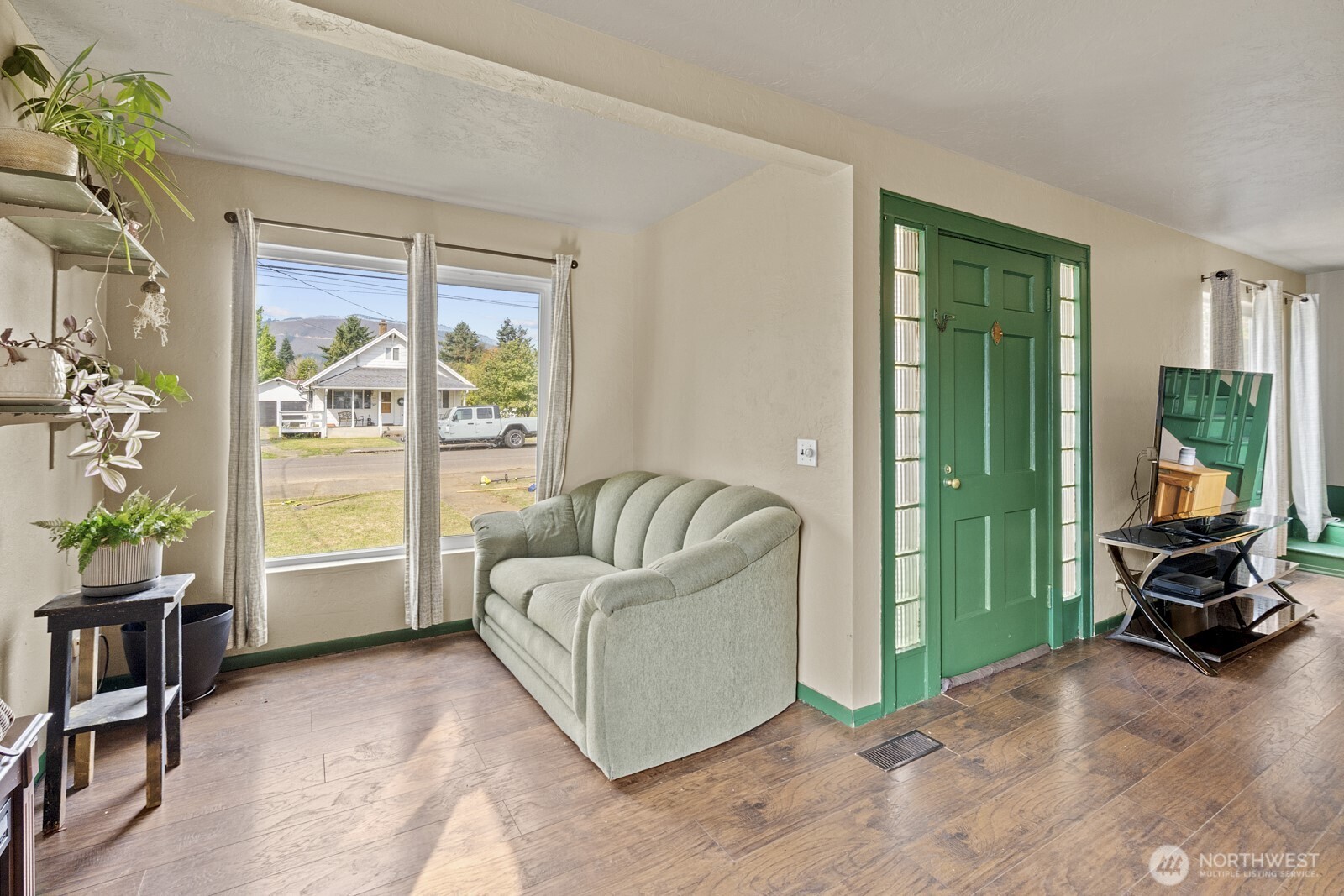 325 3rd Street Morton, WA 98356 - Photo 7 of 40 a living room with furniture and a large window