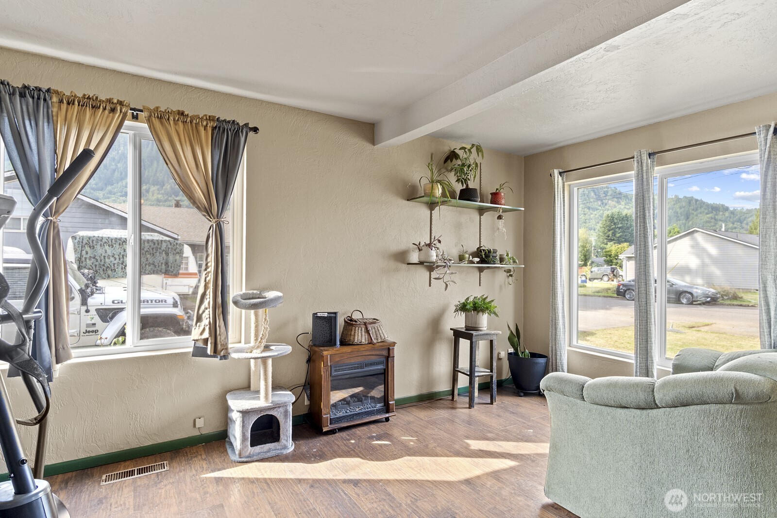 325 3rd Street Morton, WA 98356 - Photo 8 of 40 a living room with furniture a window and a flat screen tv