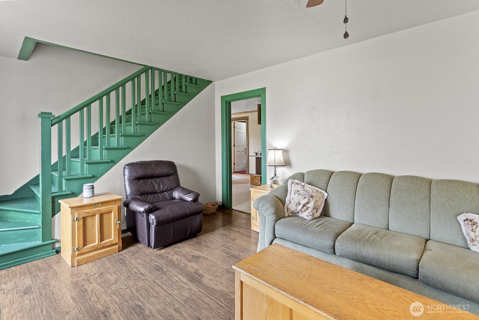 325 3rd Street Morton, WA 98356 - Photo 9 of 40 a living room with furniture and a wooden floor