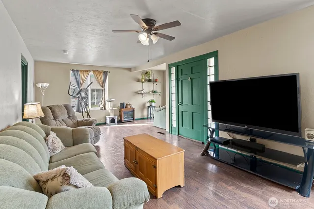 a living room with furniture and a large window