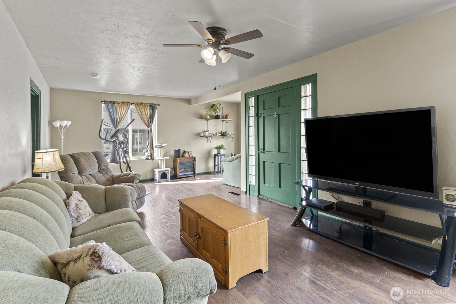 325 3rd Street Morton, WA 98356 - Photo 10 of 40 a living room with furniture and a flat screen tv