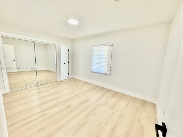 a view of an empty room and window