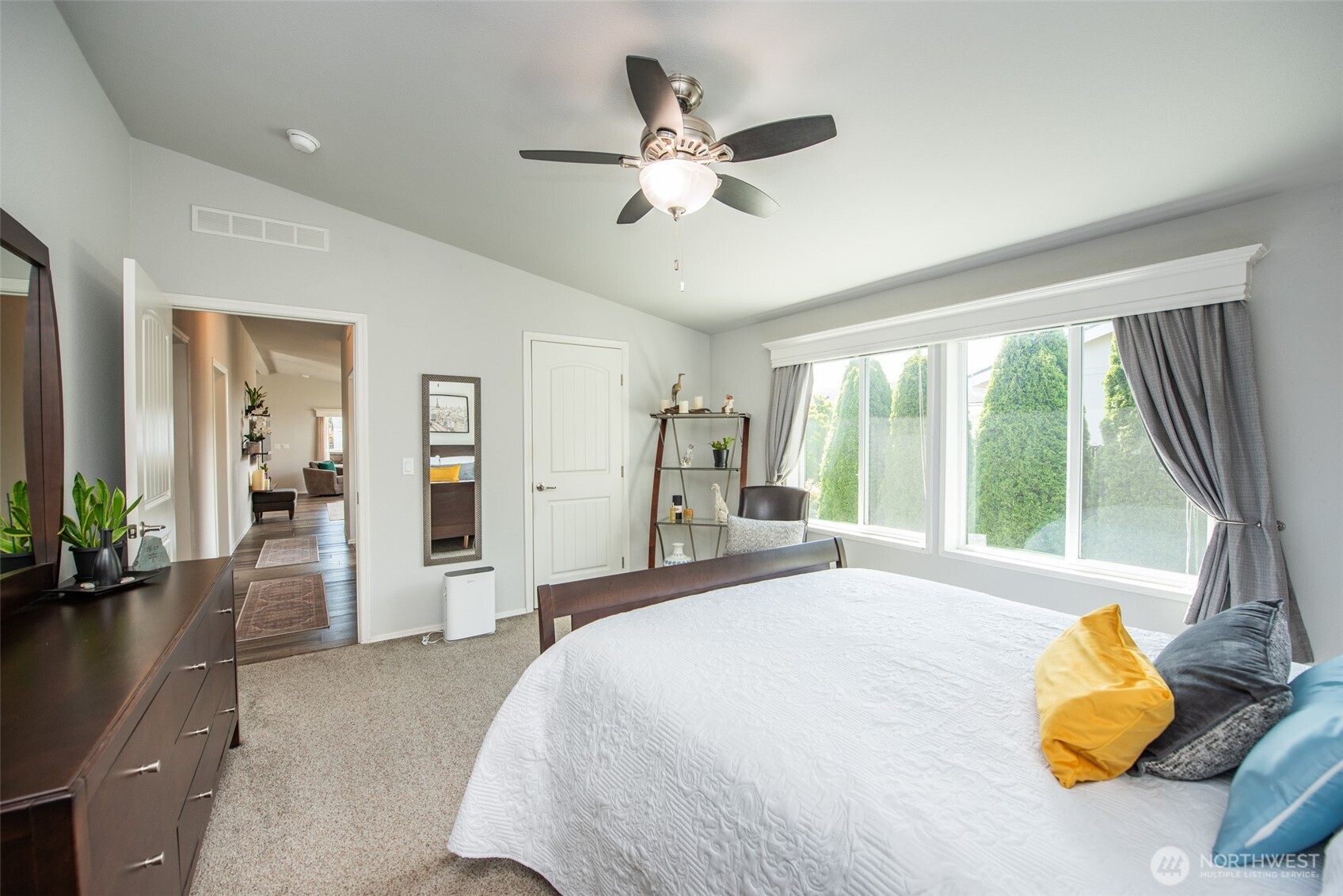 720 West Heritage Loop Sequim, WA 98382 - Photo 22 of 35 a bedroom with bed and glass door
