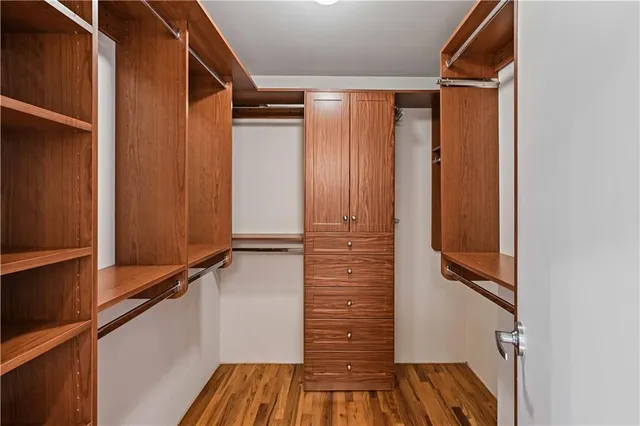 a view of a room with wooden floor