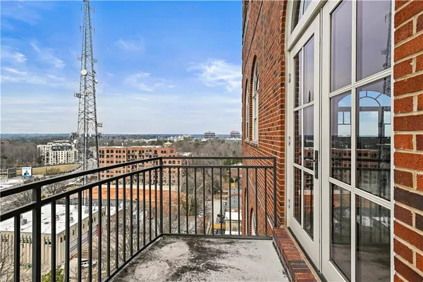 a view of a balcony with city view