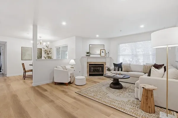 a living room with fireplace furniture and a fireplace