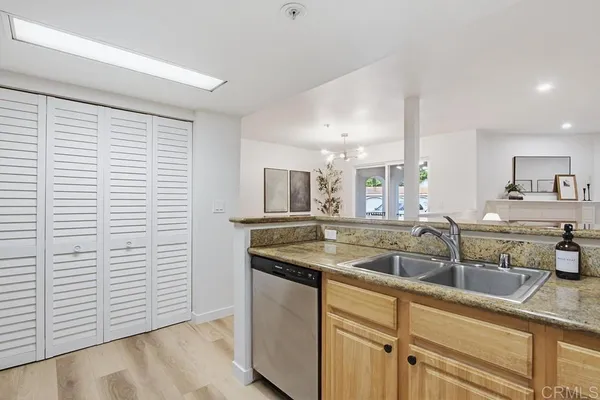 a kitchen with a sink and cabinets