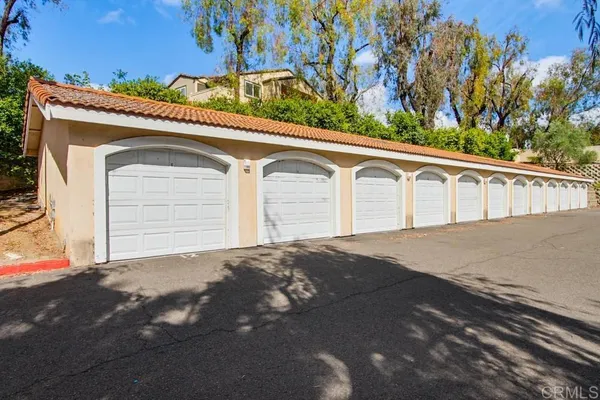 a side view of a house with a garage