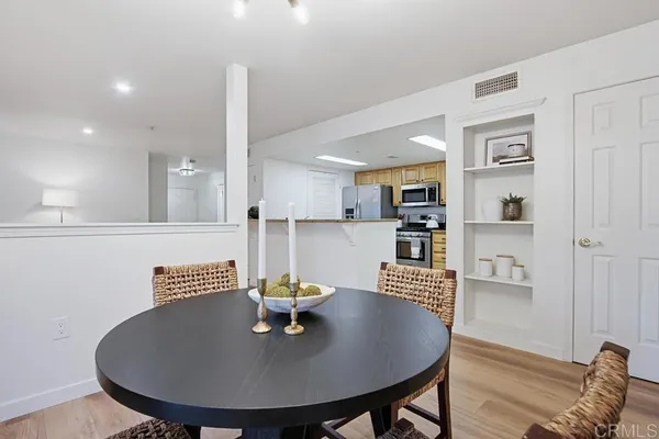a view of kitchen and dining area with furniture